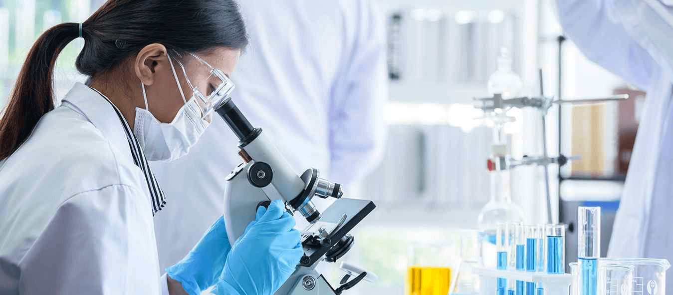 Doctor examining with microscope